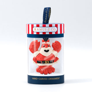 Dark blue ornament tin with clear front window showing Santa figure and red details