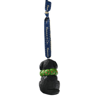 Bottom view of hanging black dog ornament with green scarf and blue ribbon