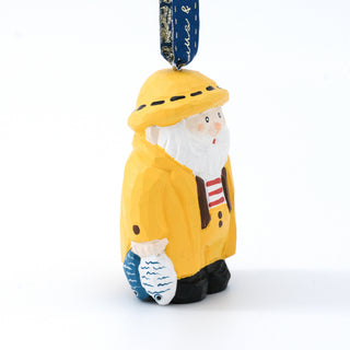 Hand-carved Santa fisherman ornament shown from the side, hanging from a navy ribbon.
